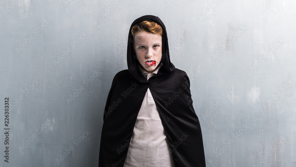Boy in vampire costume for halloween holidays
