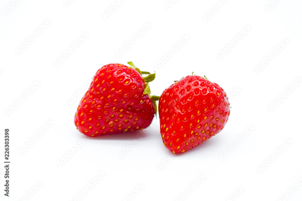 Two whole strawberries isolated on white background Two whole strawberries isolated on white background