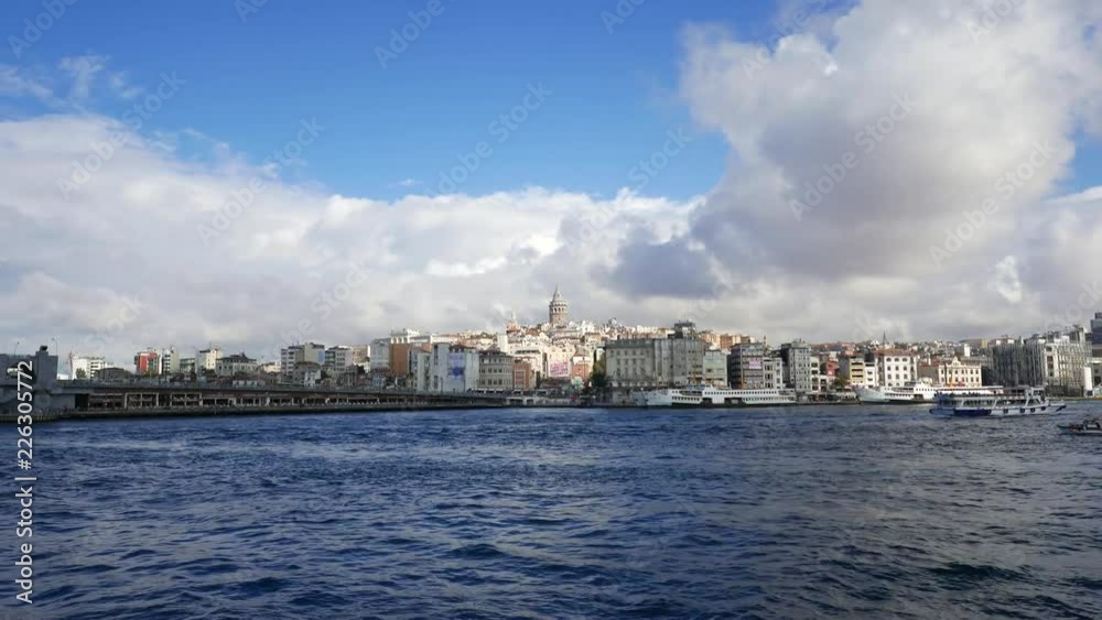 Galata tower (centre) viewed from moving ferry in Istanbul, Turkey. Galata tower (centre) viewed from moving ferry in Istanbul, Turkey.
