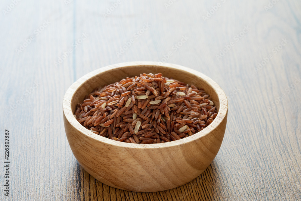 brown rice for healthy wood bowl on wood background brown rice for healthy wood bowl on wood background