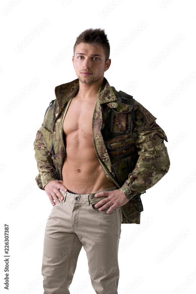 Muscular young man with military jacket on naked torso, isolated on white Muscular young man with military jacket on naked torso, isolated on white