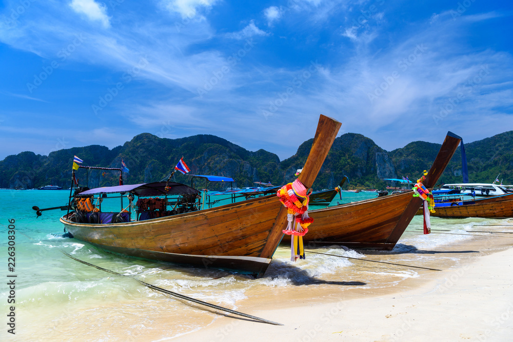 Long tail boats on tropical beach, Phi Phi Don island, Andaman s Long tail boats on tropical beach, Phi Phi Don island, Andaman s