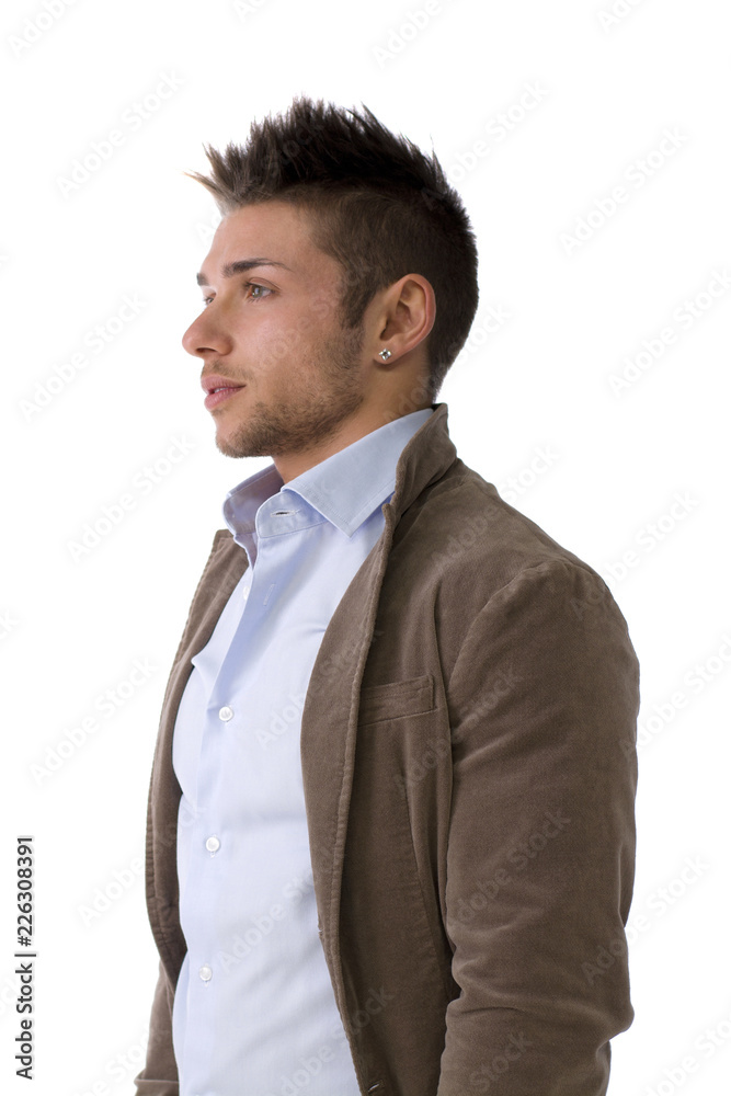 Handsome young man portrait, standing isolated on white, profile position Handsome young man portrait, standing isolated on white, profile position