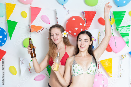 Sexy hot girl wearing bikini dancing party event new year or birthday.confetti happy and funny concept