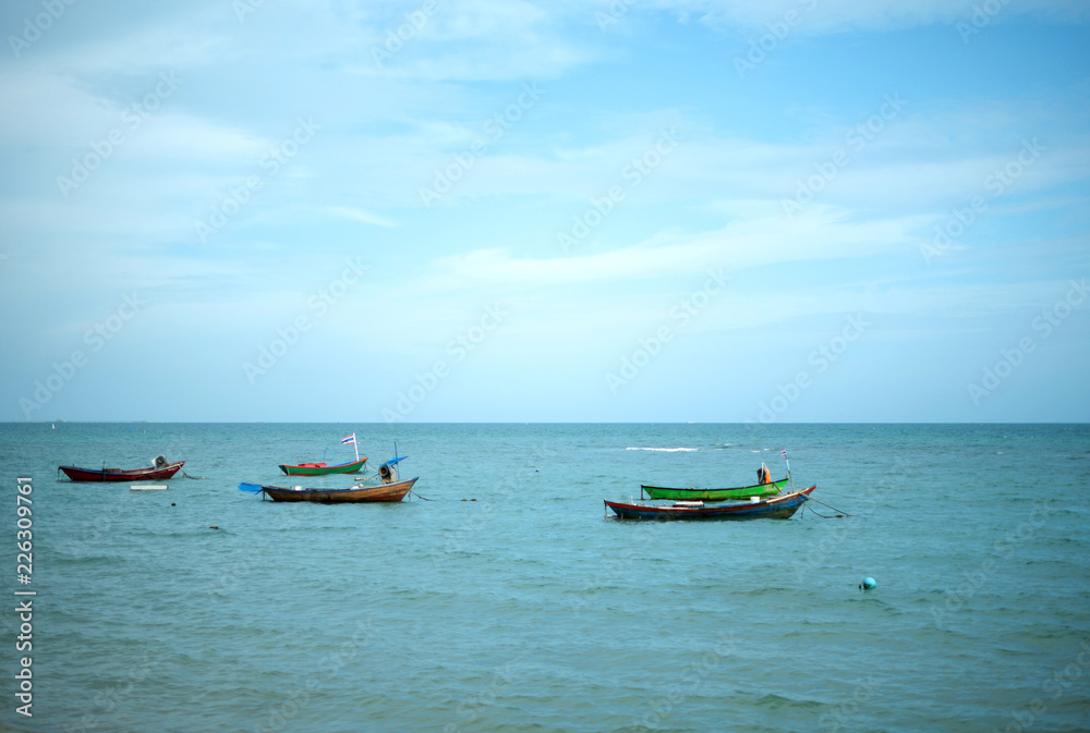 Five small fishing boat parking on the sea