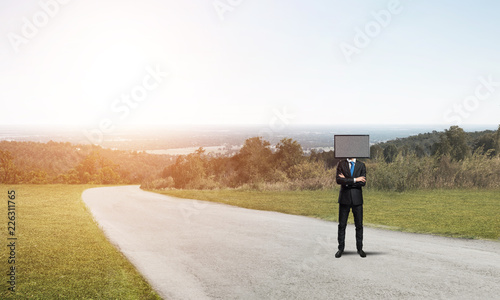 Businessman with TV instead of head.