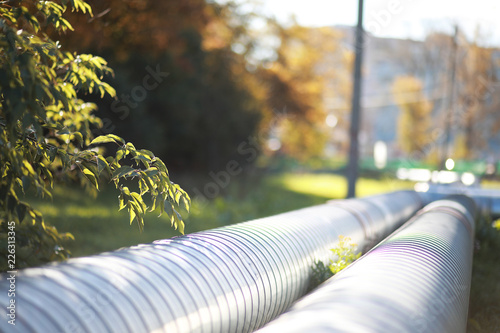 Industrial pipes on street construction photo