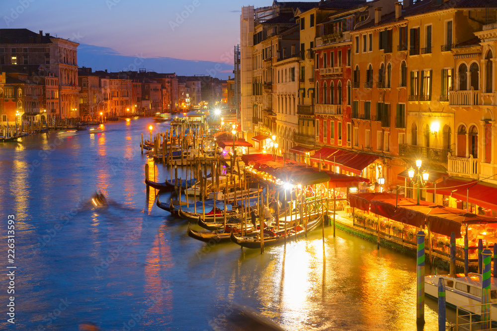 Grand Canal gondolas embankmentat illuminated at night, Venice Italy