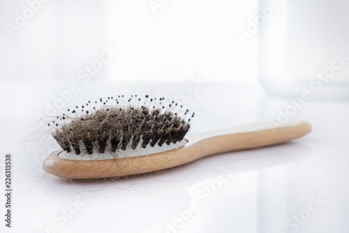 Hairbrush covered with hair