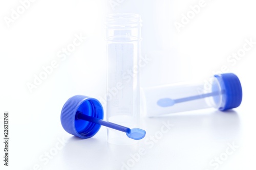 Stool sample container and spatula