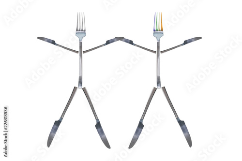 Two little dancing men figures made from cutlery. Silver shiny fork with colorful prongs and knives. Isolated white background. Cutlery LGBT concept design. Copy space photo