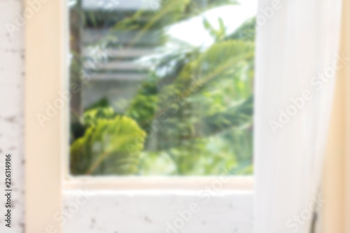 Defocused window background with white curtains in morning time.