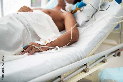 Konstfotografi Close up of patient hand with intravenous drip and pulse oximeter sensor on fing