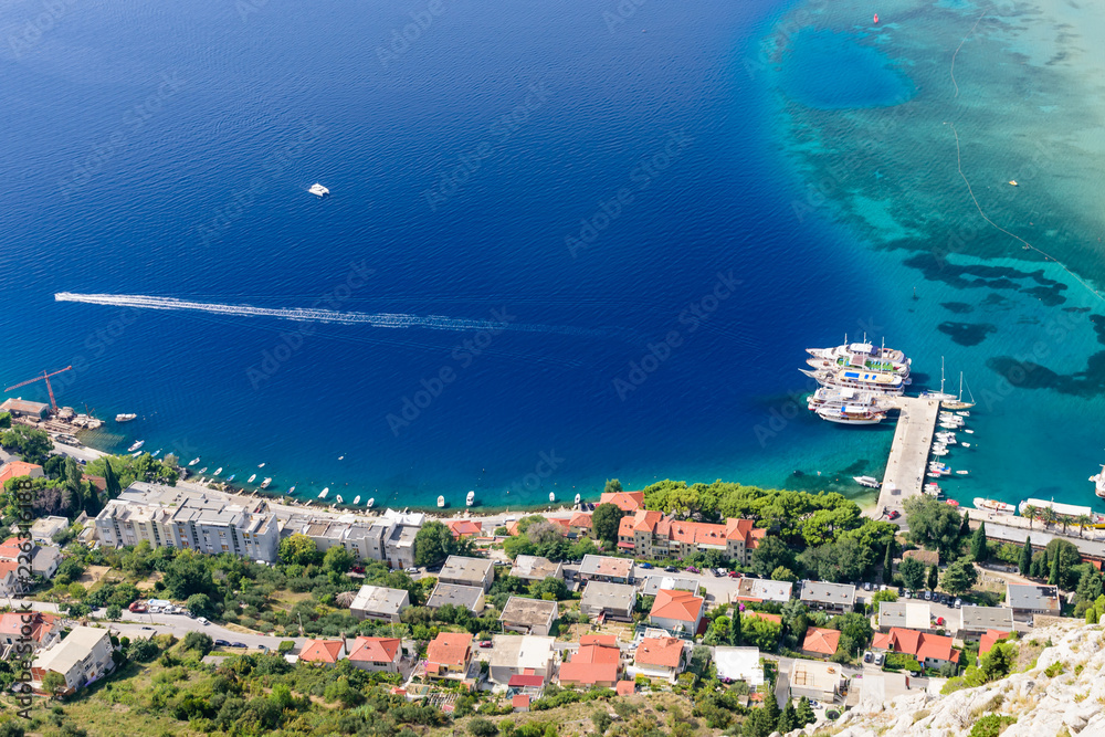 Beautiful aerial view of the coastline and the Adriatic sea, Omis town, Dalmatia region, Croatia