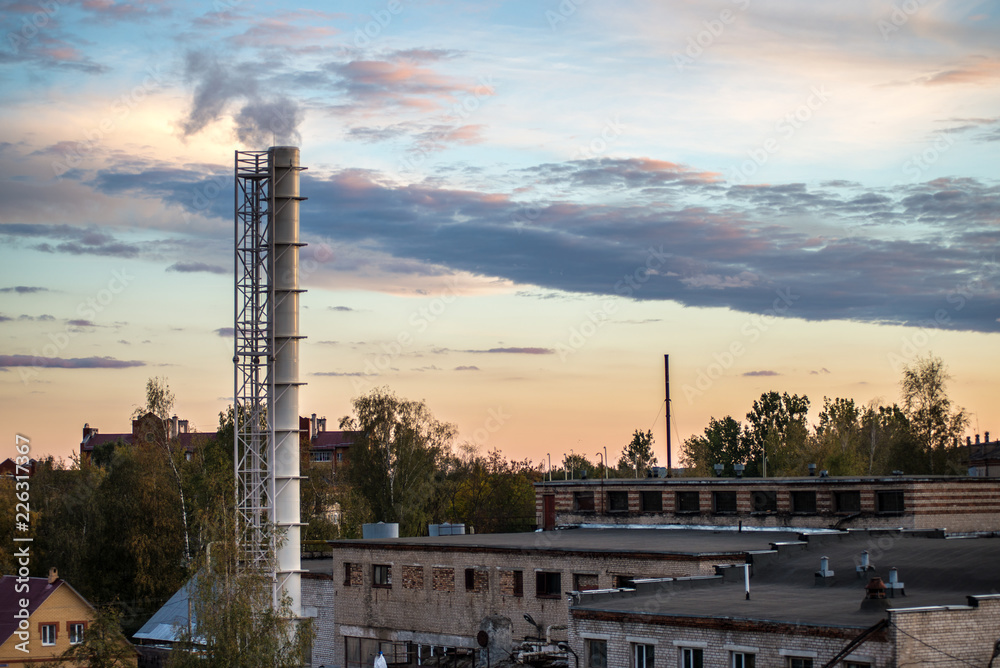 pipe factory smoke in the background of a beautiful sky pipe factory smoke in the background of a beautiful sky