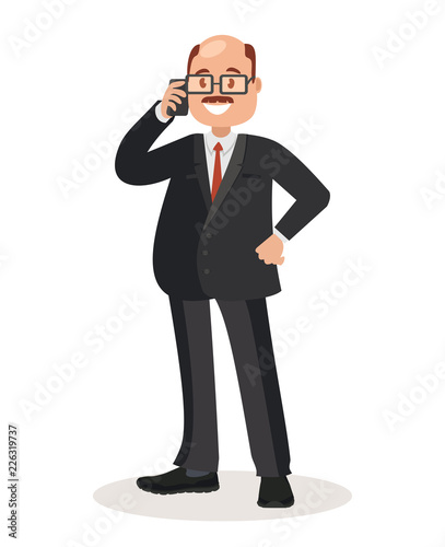 Businessman with glasses and dressed in a business suit talking on the phone.