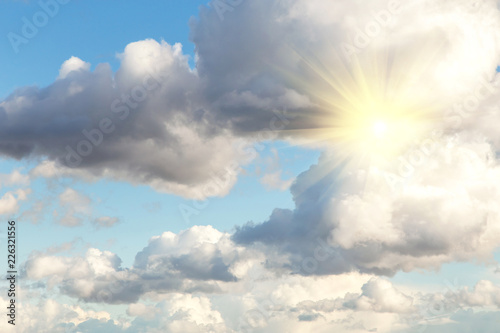 Blue sky with clouds and sun, sunlight