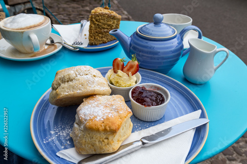 english cream tea with scones, clotted cream, marmelade and tea