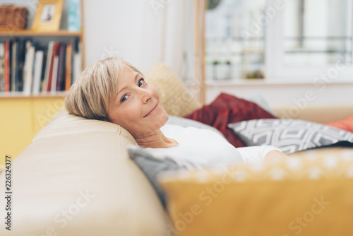 Attractive blond woman relaxing at home