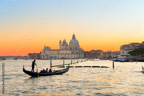 Basilica Santa Maria della Salute and lagoon water at sunset, Venice, Italy © neirfy