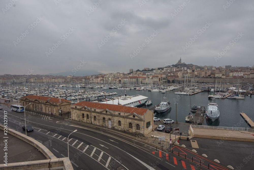 Aerial panoramic view on basilica of Notre Dame de la Garde and old port in Marseille, France
