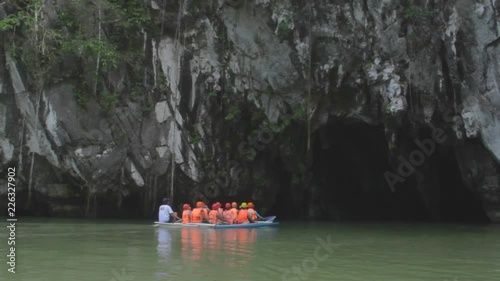 Palawan Cave Adventure. A group of tourists enter the Puerto Princesa Subterranean River National Park on the Palawan Island of the Philippines.