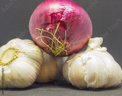 two heads of garlic and one purple onion