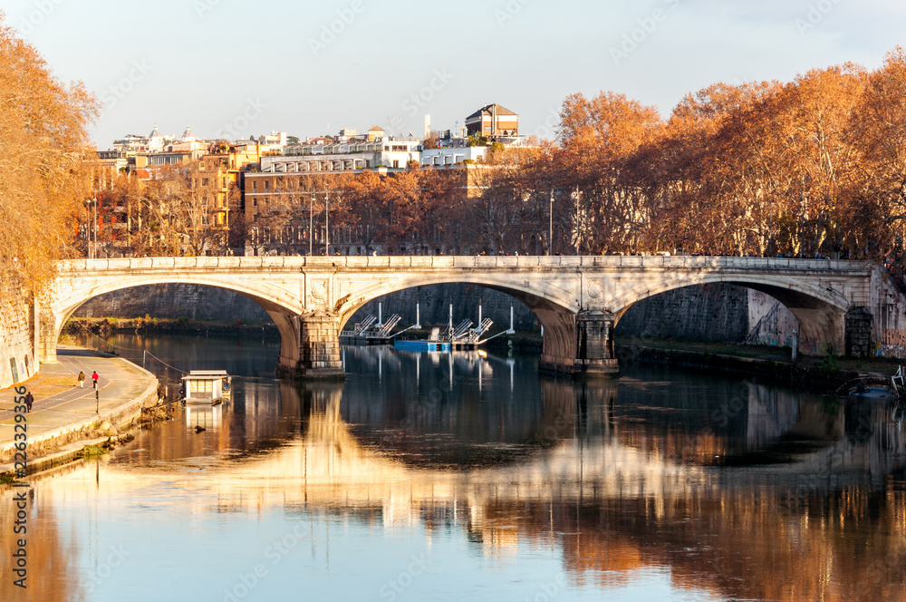 Ancient stone bridge on the river in Rome