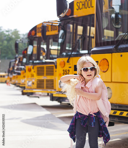 Little girl at school bus