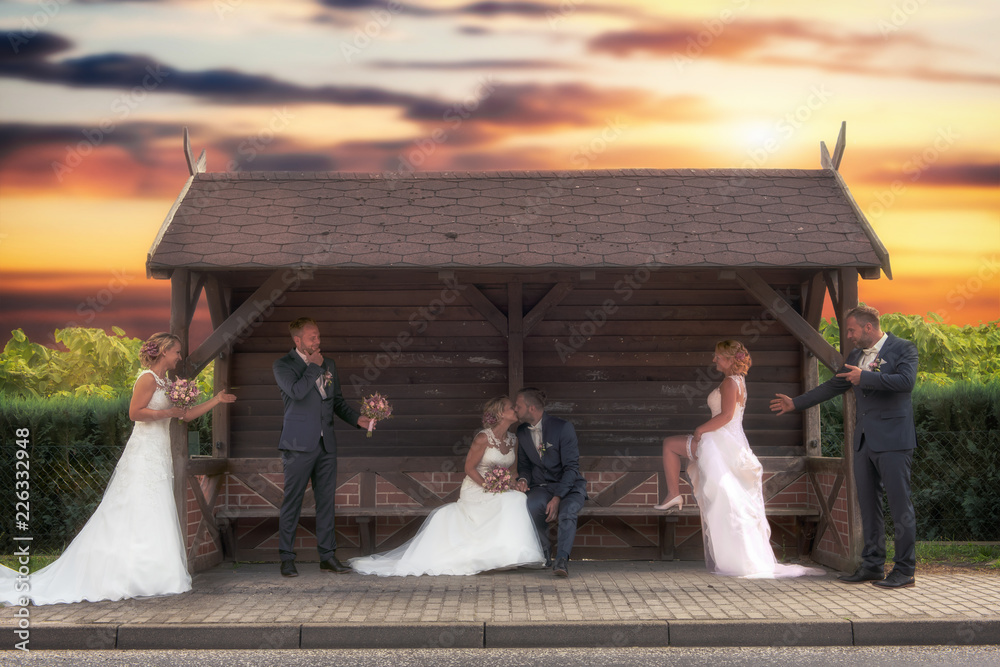 Fototapeta premium Bride and groom were photographed several times in a bus stop. Concept: wedding and couple shooting