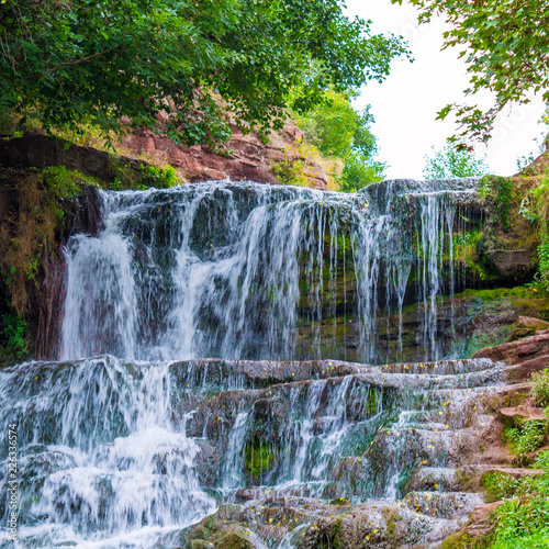Photo of high waterfall in the mountains