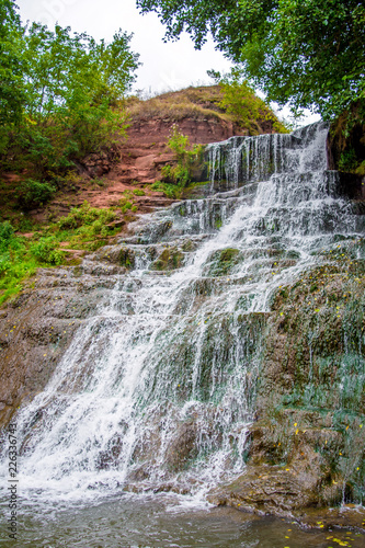 Photo of high waterfall in the mountains