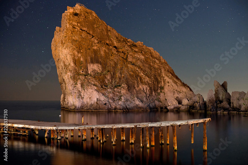 Beauty of Night Diva. Night shot of starry dark blue sky, mountains and sea. Crimea, Ukraine