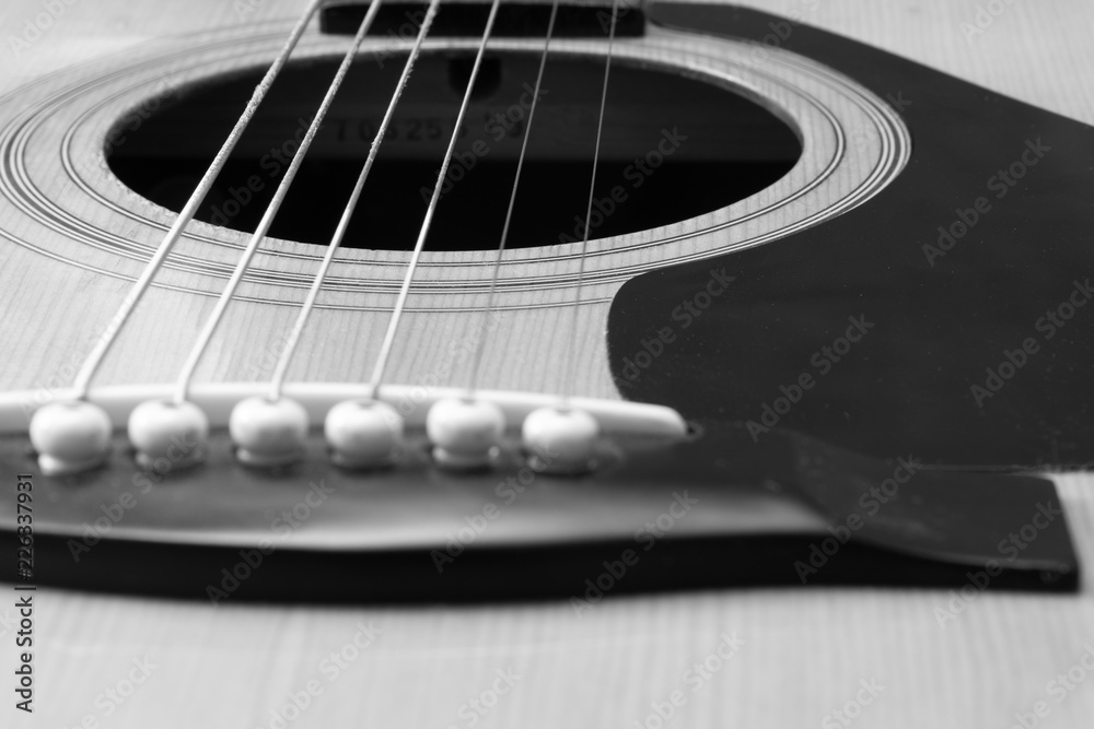 Close up black and white of acoustic guitar Close up black and white of acoustic guitar