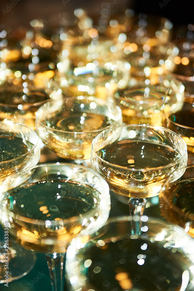 Lots of full champagne and wine glasses Lots of full champagne and wine glasses