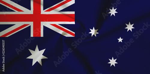 National flag of Australia on a waving cotton texture background © Onur