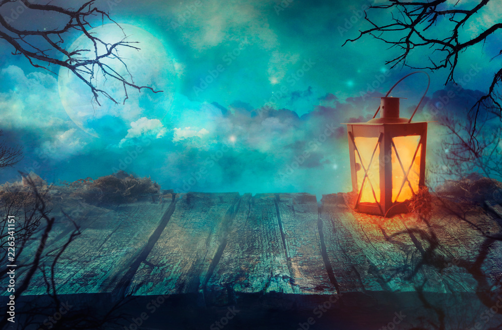 Obraz premium Old Table With Lantern And Full Moon.