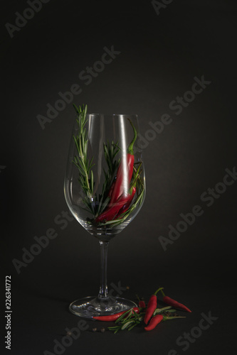 red chili peppers in a rosemary glass