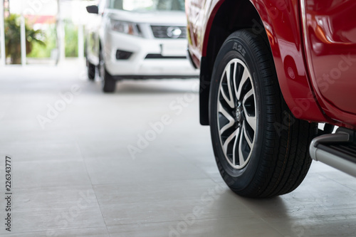 closeup car wheel with soft-focus and over light in the background