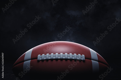 Tableau sur toile 3d rendering of a leather ball for American football lying with its seams in focus on a dark background
