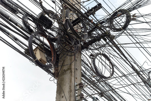 closeup electricity post with soft-focus and over light in the background photo