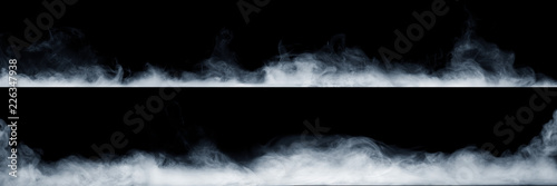 Panoramic view of the abstract fog or smoke move on black background. White cloudiness, mist or smog background. photo