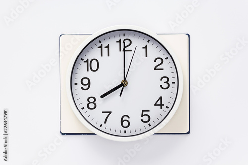 open notebook and clock watch on white background