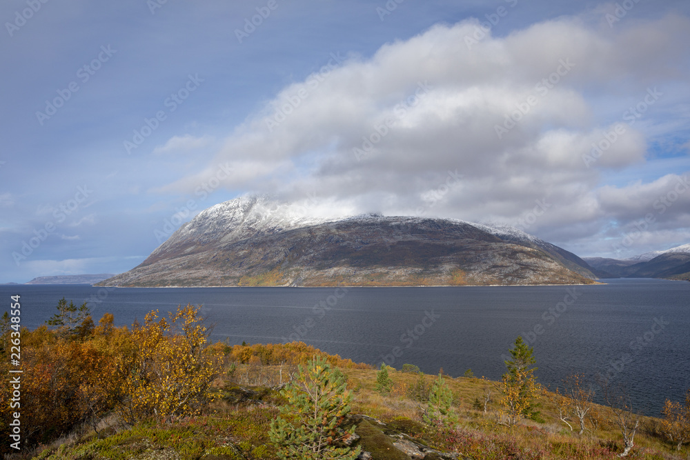 Winter comes with snow in the mountains in Northern Norway	