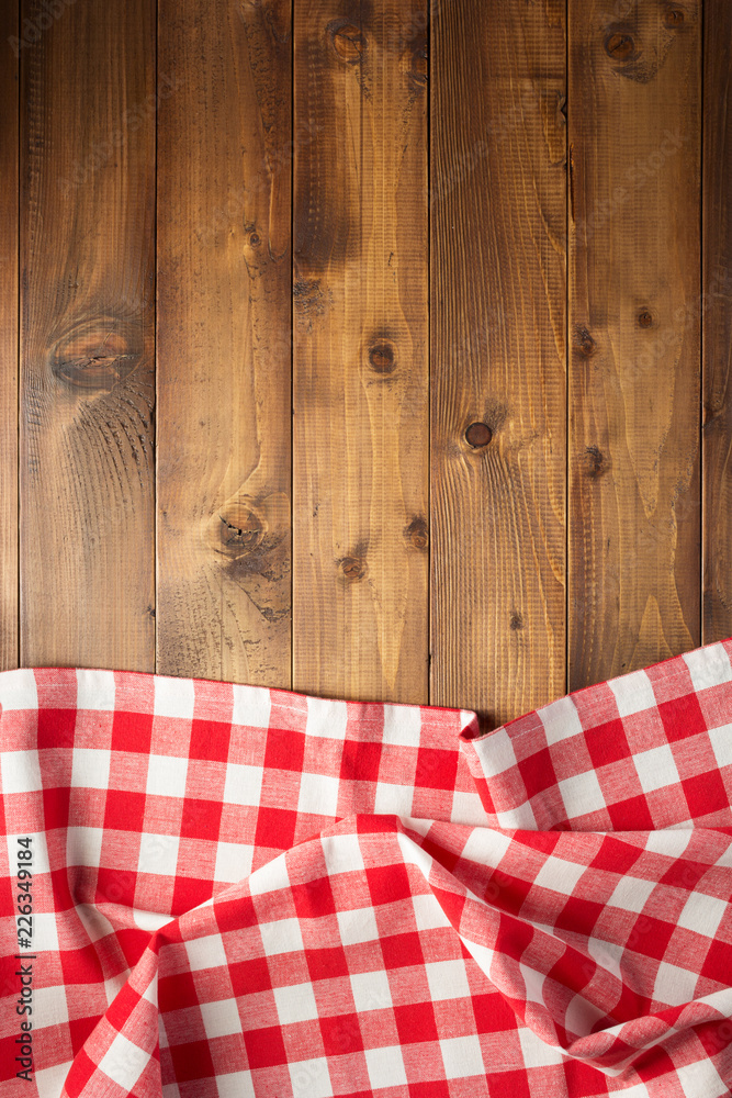 checked table cloth at wooden  background
