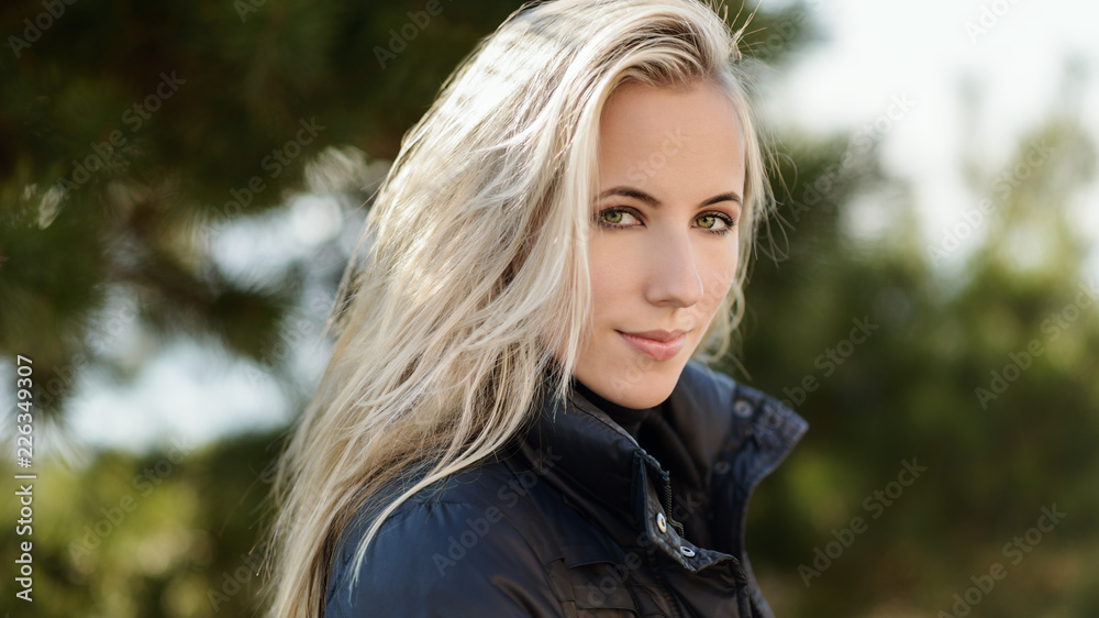 Portrait of young woman at sunny day. Portrait of young woman at sunny day.