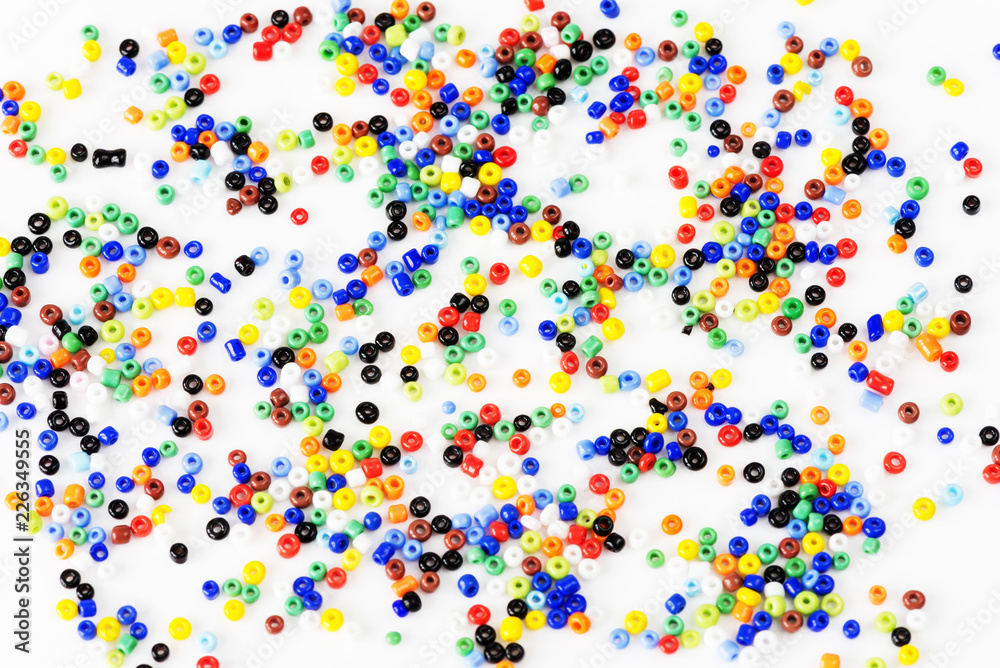 Multi-colored beads on a white background