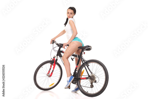 young athletic girl on a bicycle