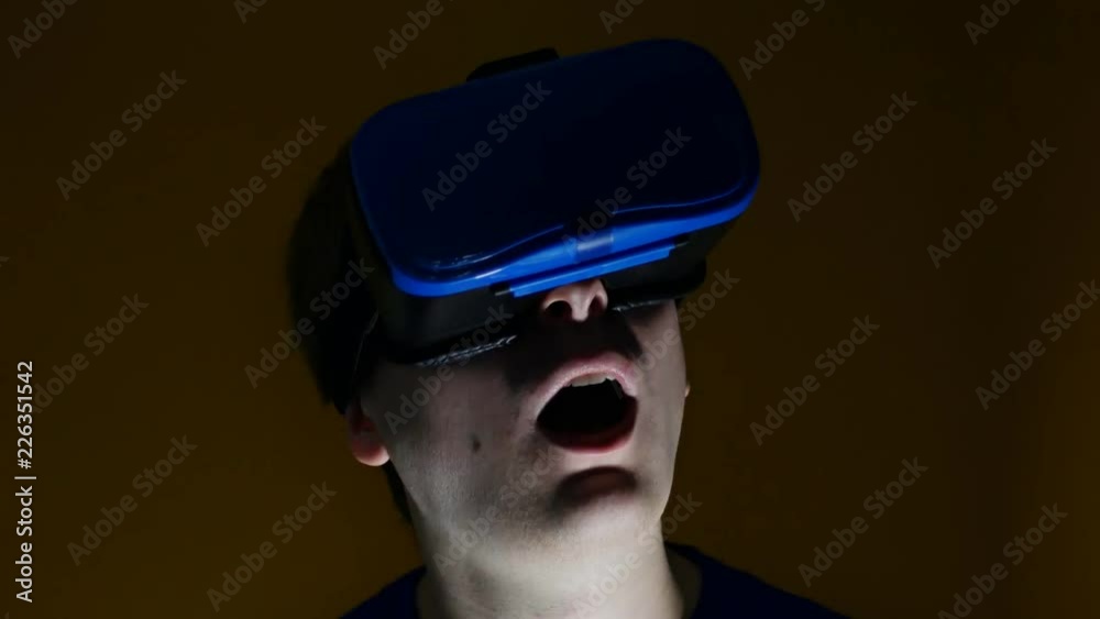 man in head-mounted display and open mouth looks around and shocked, virtual reality, hmd 360 man in head-mounted display and open mouth looks around and shocked, virtual reality, hmd 360