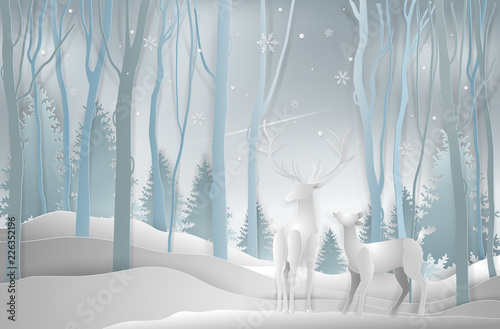 Winter season and Christmas day, Deer in forest landscape with snowflakes and mountains background. paper art and digital craft style. Vector illustration.